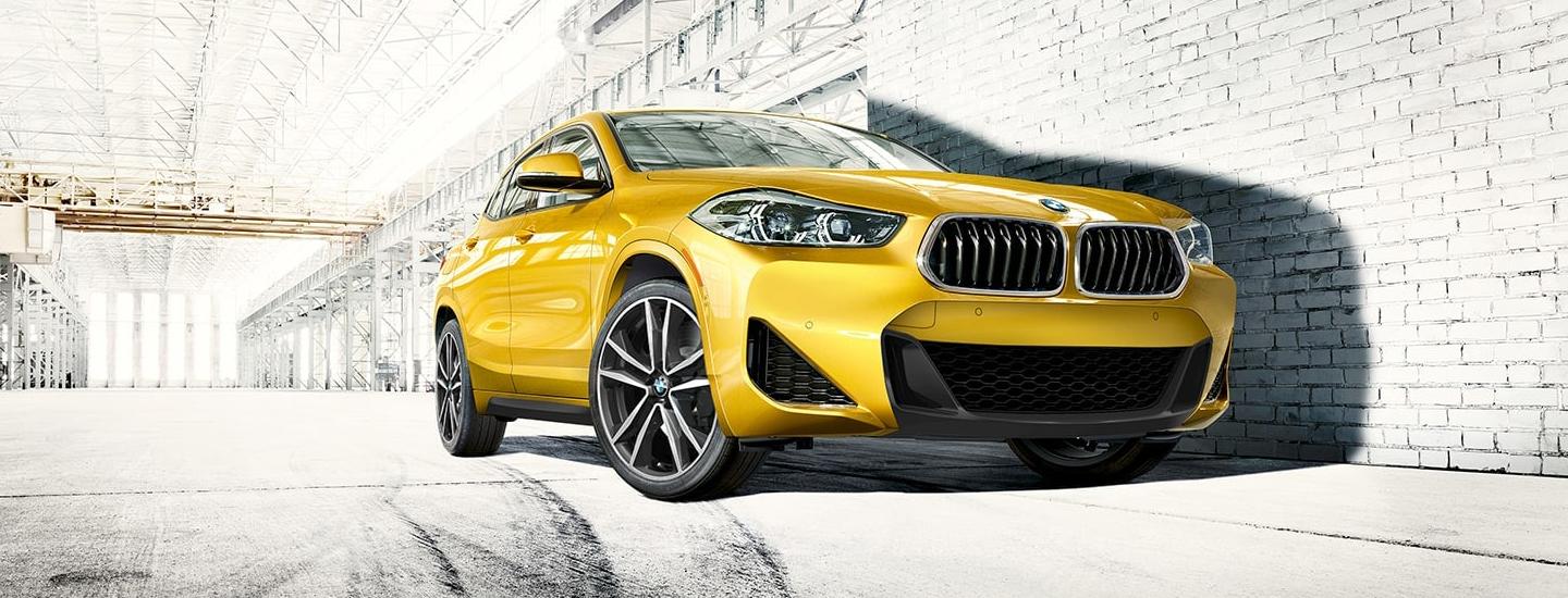 Parked yellow 2023 BMW X2