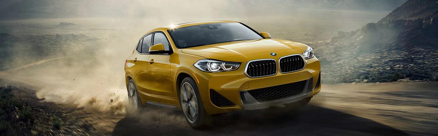 2023 BMW X2 driving on a dirt road
