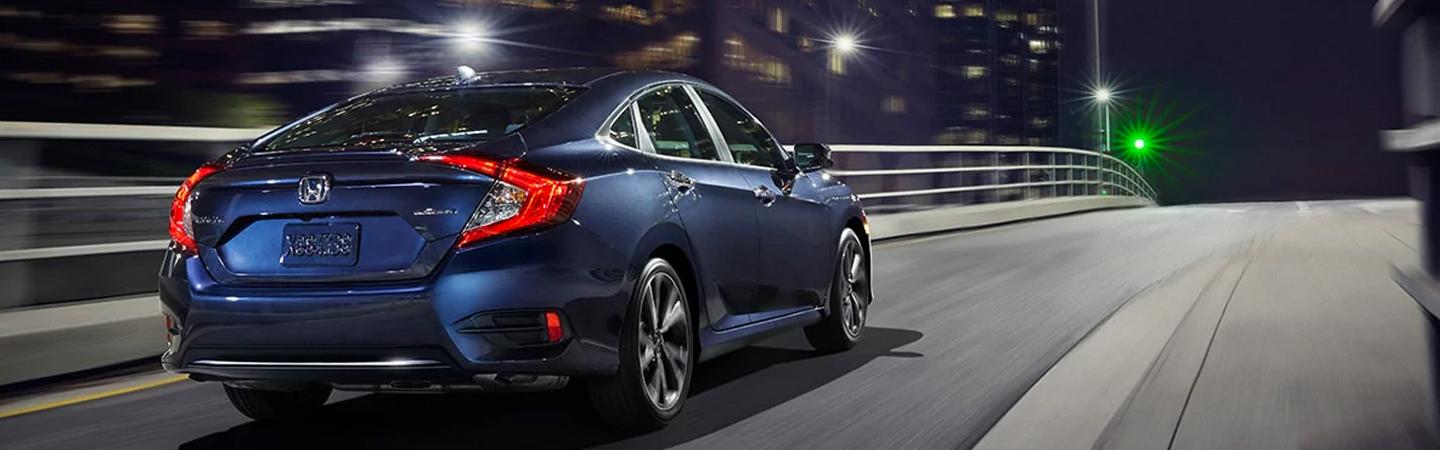 Rear passenger view of a Blue Honda Civic