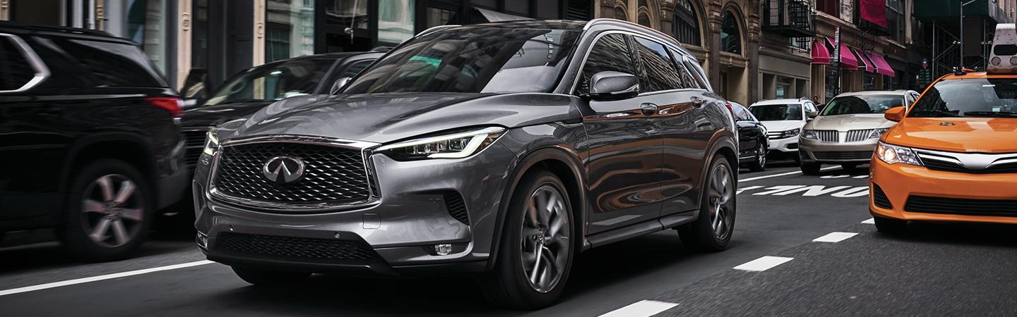 Front view of the 2021 INFNIITI QX50 in traffic