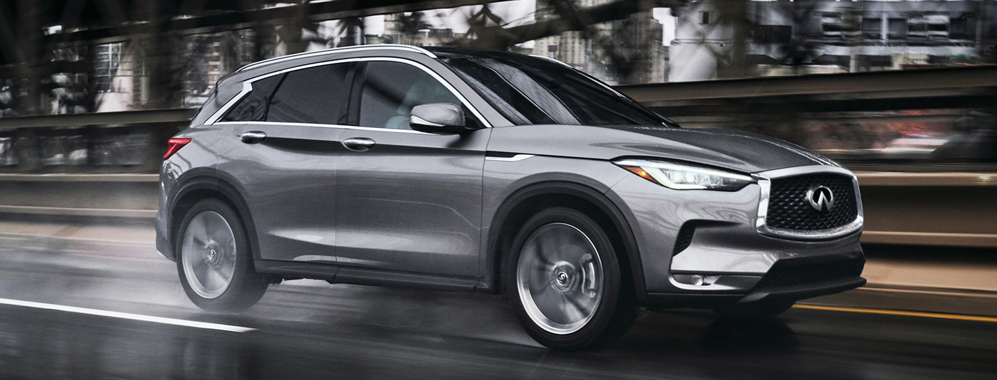 2021 INFINITI QX50 in motion through a wet road