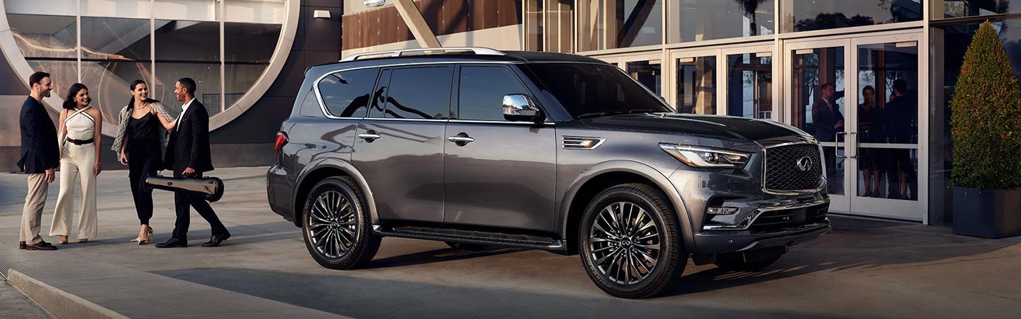 2022 INFINITI QX80 parked in front concert hall