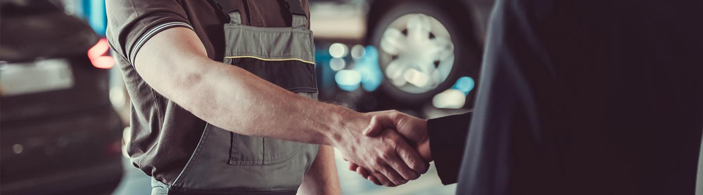 Mechanic shaking hands with someone