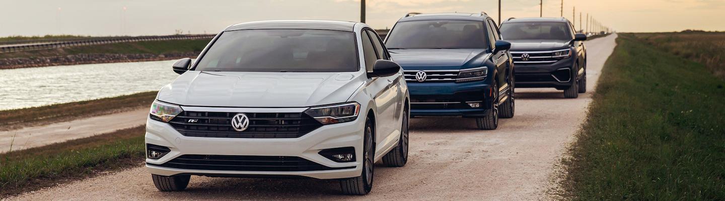 Certified Pre-Owned Volkswagen Models driving down dirt road