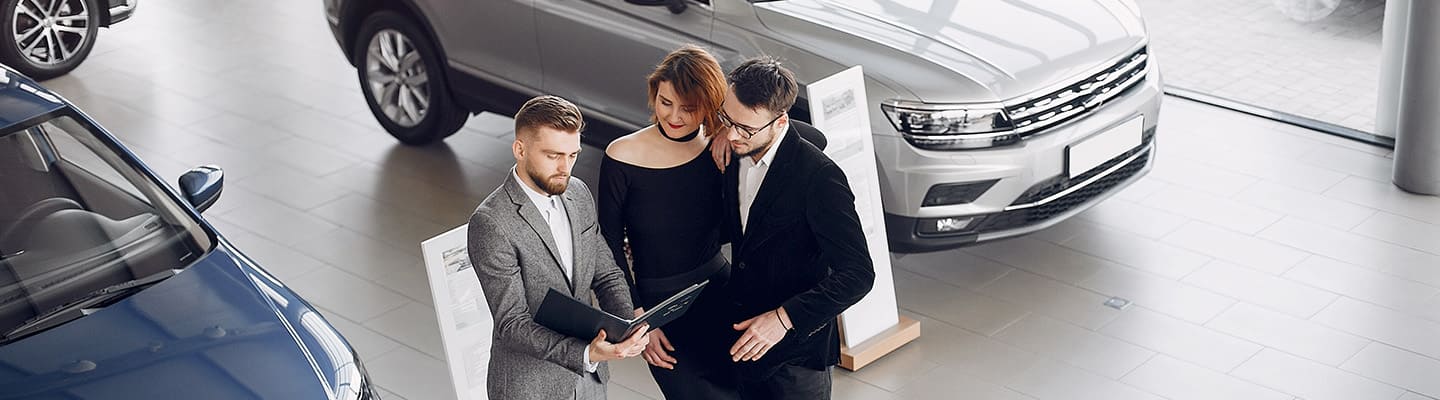 people in new car showroom